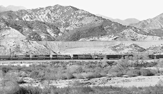 Eastbound Atchison, Topeka and Santa Fe Railway empty coal train (right) gets help from empty grain train on climb to Cajon Summit in June 1968. Photograph by J. Parker Lamb, © 2017, Center for Railroad Photography and Art. Lamb-02-100-12