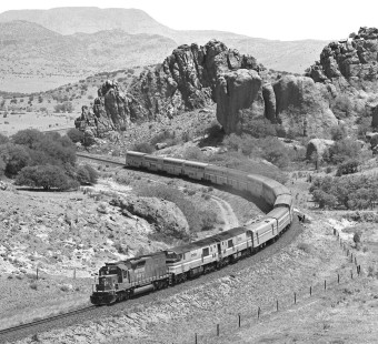 Westbound Amtrak <i>Sunset Limited</i> passenger train nears Paisano Summit behind Southern Pacific unit after one of its GE locomotives failed in June 1984. Photograph by J. Parker Lamb, © 2017, Center for Railroad Photography and Art. Lamb-02-085-06