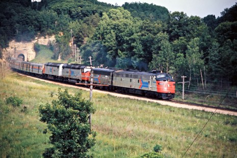 Westbound Amtrak passenger train  no. 7, the <i>Empire Builder</i>, at Tunnel City, Wisconsin, on July 5, 1975. Photograph by John F. Bjorklund, © 2016, Center for Railroad Photography and Art. Bjorklund-64-26-13