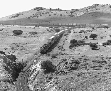 Quartette of GE B-39 locomotives leads a Southern Pacific Railroad stack train over Paisano crest in Alpine, Texas, in September 1987. Photograph by J. Parker Lamb, © 2017, Center for Railroad Photography and Art. Lamb-02-086-02