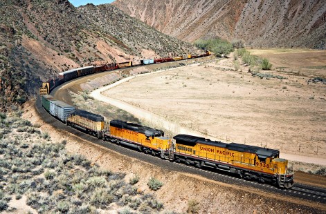 Eastbound Union Pacific Railroad freight train at Clover Creek near Eccles, Nevada, on April 10, 1989. Photograph by John F. Bjorklund, © 2016, Center for Railroad Photography and Art. Bjorklund-91-26-08