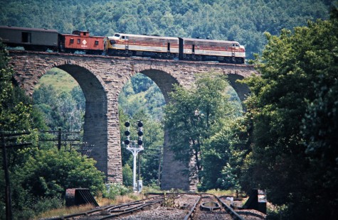 Westbound Erie Lackawanna Railway freight train crossing Starrucca Viaduct at Lanesboro, Pennsylvania, on July 22, 1975. Photograph by John F. Bjorklund, © 2016, Center for Railroad Photography and Art. Bjorklund-55-08-18