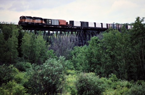 Southbound Milwaukee Road freight train on Burlington Northern track in Boylston, Wisconsin, on August 8, 1982. Photograph by John F. Bjorklund, © 2016, Center for Railroad Photography and Art. Bjorklund-69-07-21