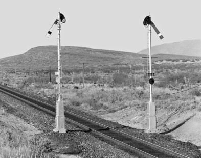 Like monks with bowed heads, Southern Pacific Railroad semaphores in New Mexico wait for next train to arouse from their rest in April 1987. Photograph by J. Parker Lamb, © 2017, Center for Railroad Photography and Art. Lamb-02-092-10