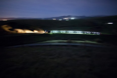 Westbound Altamont Commuter Express train on the west slope of Altamont Pass near Livermore, California, in the predawn of January 29, 2013.