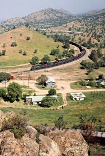 Westbound Southern Pacific Railroad freight train near the Tehachapi Loop at Walong, California, on April 14, 1989. Photograph by John F. Bjorklund, © 2016, Center for Railroad Photography and Art. Bjorklund-87-23-05