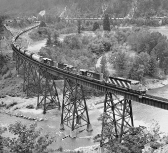 Eastbound Canadian National Railway empty grain train nears Boston Bar, British Columbia, in June 1978. Canadian Pacific Railway train hugs west bank of Fraser River. Photograph by J. Parker Lamb, © 2017, Center for Railroad Photography and Art. Lamb-02-113-07