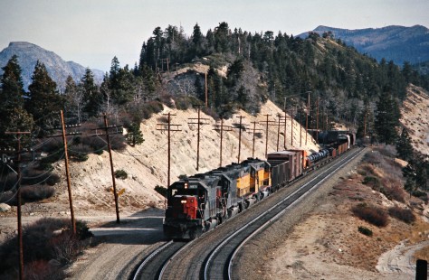 Westbound Southern Pacific Railroad freight train at Emigrant Gap, California, on December 29, 1976. Photograph by John F. Bjorklund, © 2016, Center for Railroad Photography and Art. Bjorklund-84-24-16