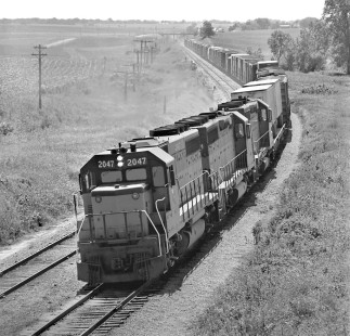 Eastbound Chicago, Milwaukee, St. Paul and Pacific Railroad freight train approaches Melbourne, Iowa, in June 1973. Photograph by J. Parker Lamb, © 2017, Center for Railroad Photography and Art. Lamb-02-107-11
