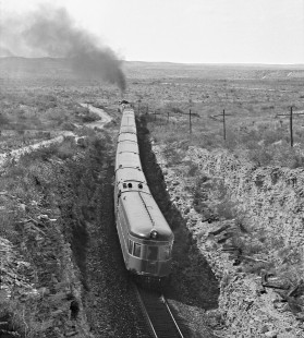 Westbound Southern Pacific Railroad passenger train leaves cut and heads toward wide open country of west Langtry, Texas, in June 1984. Photograph by J. Parker Lamb, © 2017, Center for Railroad Photography and Art. Lamb-02-090-05