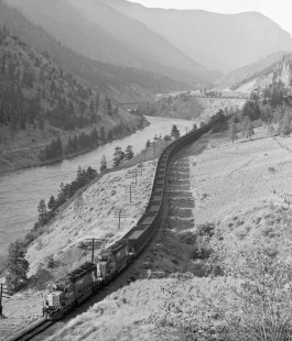 Westbound Canadian Pacific Railway coal train approaches Lytton, British Columbia, in June 1978. Note Canadian National Railway freight train in distant shadows. Photograph by J. Parker Lamb, © 2017, Center for Railroad Photography and Art. Lamb-02-113-06