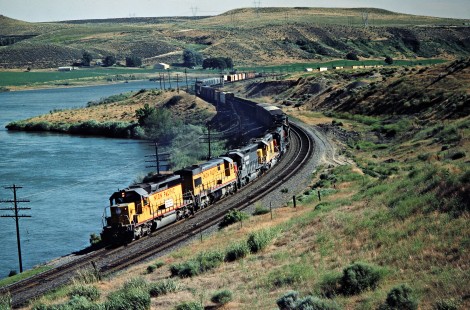 Eastbound Union Pacific Railroad freight train along Snake River in King Hill, Idaho, on June 29, 1984. Photograph by John F. Bjorklund, © 2016, Center for Railroad Photography and Art. Bjorklund-90-11-03