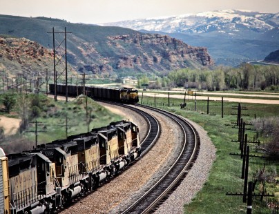 Eastbound and westbound Union Pacific Railroad freight trains meet at Henefer, Utah, on May 13, 1986. Photograph by John F. Bjorklund, © 2016, Center for Railroad Photography and Art. Bjorklund-90-21-22