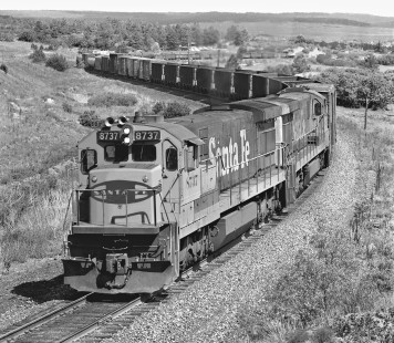 A pair of GE locomotives head north from Palmer Lake, Colorado, with a short Atchison, Topeka and Santa Fe Railway freight train for Denver in June 1981. Photograph by J. Parker Lamb, © 2017, Center for Railroad Photography and Art. Lamb-02-100-07