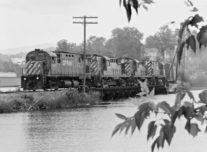 Westbound Canadian Pacific Railway local freight train departs Newport, Vermont, behind four MLW locomotives in July 1981. Photograph by J. Parker Lamb, © 2017, Center for Railroad Photography and Art. Lamb-02-113-02