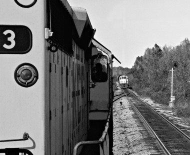 Southbound Kansas City Southern Railway manifest freight train waits for yard to clear in DeQueen, Arkansas, allowing near train to depart in April 1985. Photograph by J. Parker Lamb, © 2016, Center for Railroad Photography and Art. Lamb-02-072-12