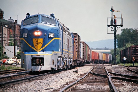 Eastbound Delaware and Hudson Railway freight train on Erie Lackawanna Railway track in Waverly, New York, on July 23, 1975. Photograph by John F. Bjorklund, © 2016, Center for Railroad Photography and Art. Bjorklund-56-07-14