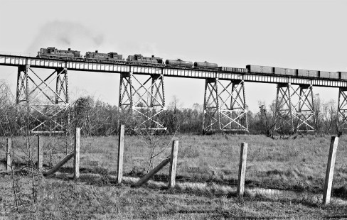 Southern Pacific Railroad transfer cut from Avondale Yard to downtown New Orleans, Louisiana, climbs Huey P. Long Bridge in later afternoon during December 1954. Photograph by J. Parker Lamb, © 2016, Center for Railroad Photography and Art. Lamb-02-057-02