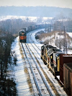 Westbound Erie Lackawanna Railway freight train meets eastbound Milwaukee Road-powered freight train near Pavonia, Ohio, on January 5, 1974. Photograph by John F. Bjorklund, © 2016, Center for Railroad Photography and Art. Bjorklund-54-22-16
