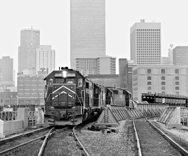 Fort Worth-bound Missouri Pacific Railroad freight train heads away from skyscrapers of downtown Dallas, Texas, in June 1975. Photograph by J. Parker Lamb, © 2016, Center for Railroad Photography and Art. Lamb-02-064-07