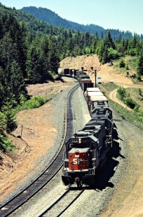 Eastbound Southern Pacific Railroad freight train at Wicopee, Oregon, on June 16, 1984. Photograph by John F. Bjorklund, © 2016, Center for Railroad Photography and Art. Bjorklund-86-11-02
