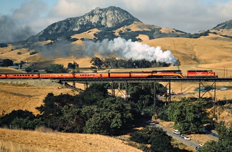 Southern Pacific Railroad passenger train, <i>Daylight</i>, led by steam locomotive no. 4449 and a diesel helper at Stenner Creek in San Luis Obispo, California, on June 20, 1984. Photograph by John F. Bjorklund, © 2016, Center for Railroad Photography and Art. Bjorklund-86-17-20