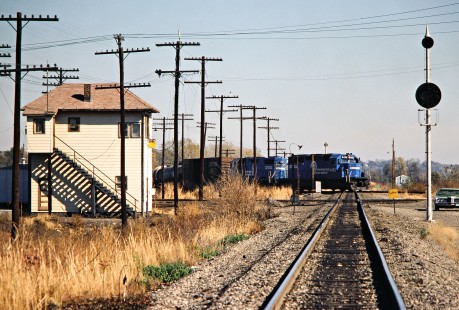 Eastbound Conrail freight train at Alton and Southern Railway-Baltimore and Ohio Railroad crossing in Washington Park, Illinois, on October 28, 1979. Photograph by John F. Bjorklund, © 2016, Center for Railroad Photography and Art. Bjorklund-81-20-02