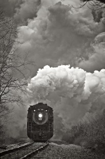 Steamtown's former Canadian National locomotive no. 3254 being "chased" by its own steam plume due to a strong tail wind blowing up the Roaring Brook gorge as the locomotive charges up the 1.5 percent grade to Moscow, Pennsylvania, on November 27, 2010. Engineer Aaron Stout and Fireman Jack Emerick III are in charge of the excursion train.