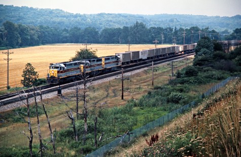 Westbound Erie Lackawanna Railway freight train in Meadville, Pennsylvania, on July 19, 1975. Photograph by John F. Bjorklund, © 2016, Center for Railroad Photography and Art. Bjorklund-55-01-15