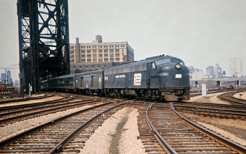 Penn Central passenger train no. 14 leaving Union Station in Chicago, Illinois for Detroit, Michigan, on April 11, 1971. Photograph by John F. Bjorklund, © 2016, Center for Railroad Photography and Art. Bjorklund-79-05-05