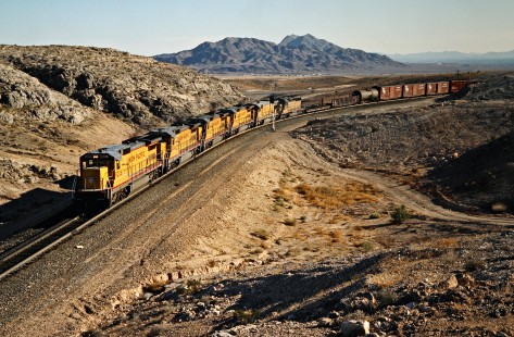 Eastbound Union Pacific Railroad freight train at Apex, Nevada, on April 10, 1989. Photograph by John F. Bjorklund, © 2016, Center for Railroad Photography and Art. Bjorklund-91-27-11