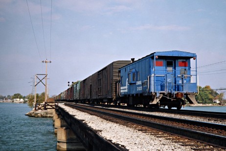 Westbound Conrail freight train crossing Bay Bridge in Danbury, Ohio, on October 22, 1977. Photograph by John F. Bjorklund, © 2016, Center for Railroad Photography and Art. Bjorklund-80-29-20