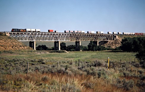 Westbound Southern Pacific Railroad freight train at Cimarron River in Kismet, Kansas, on September 27, 1986. Photograph by John F. Bjorklund, © 2016, Center for Railroad Photography and Art. Bjorklund-87-01-17