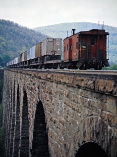 Westbound Erie Lackawanna Railway freight train on the Starrucca Viaduct at Lanesboro, Pennsylvania, on May 25, 1973. Photograph by John F. Bjorklund, © 2016, Center for Railroad Photography and Art. Bjorklund-54-12-22