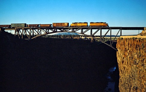 Southbound Union Pacific Railroad freight train crossing Crooked River Railroad Bridge near Opal Springs, Oregon, on August 17, 1978. Photograph by John F. Bjorklund, © 2016, Center for Railroad Photography and Art. Bjorklund-89-28-06