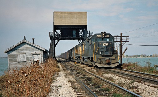 Eastbound Conrail freight train crossing Bay Bridge in Danbury, Ohio, on October 22, 1977. Photograph by John F. Bjorklund, © 2016, Center for Railroad Photography and Art. Bjorklund-80-29-03