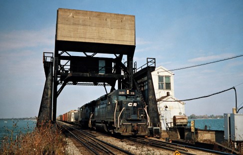 Eastbound Conrail freight train crossing Bay Bridge in Danbury, Ohio, on October 22, 1977. Photograph by John F. Bjorklund, © 2016, Center for Railroad Photography and Art. Bjorklund-80-29-11