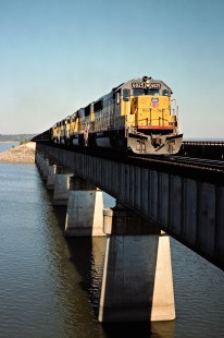 Southbound Missouri–Kansas–Texas Railroad coal train led by Union Pacific locomotives at the Eufaula Reservoir in Canadian, Oklahoma, on October 16, 1988. Photograph by John F. Bjorklund, © 2016, Center for Railroad Photography and Art. Bjorklund-70-20-10