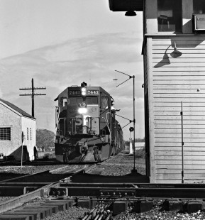 Engineer of westbound Southern Pacific Railroad freight train leans out to pick up orders at Tower 3 in Flatonia, Texas, in August 1986. Photograph by J. Parker Lamb, © 2016, Center for Railroad Photography and Art. Lamb-02-078-04