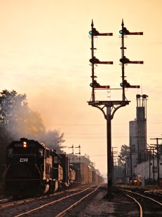 Westbound Conrail freight train at Morgan Tower in Quincy, Ohio, on September 26, 1976. Photograph by John F. Bjorklund, © 2016, Center for Railroad Photography and Art. Bjorklund-80-14-12