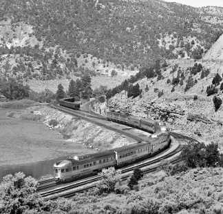 Westbound Denver and Rio Grande Western Railroad's <i>Rio Grande Zephyr</i> passenger train nears Bond, Colorado, in July 1980. Train will cross over to left line, which leads to Dotsero Cutoff and route to Salt Lake City, Utah. Right side main heads northwestward to Craig, Colorado. Photograph by J. Parker Lamb, © 2017, Center for Railroad Photography and Art. Lamb-02-098-08