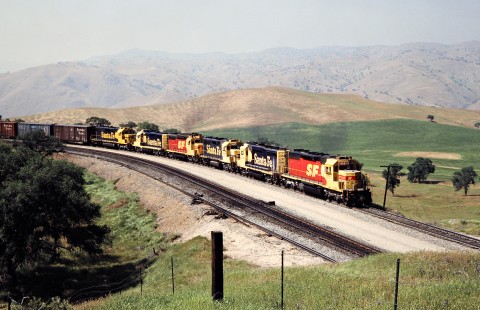 Eastbound Atchison, Topeka and Santa Fe freight train on Southern Pacific Railroad track in Bealville, California, on April 14, 1989. Photograph by John F. Bjorklund, © 2016, Center for Railroad Photography and Art. Bjorklund-87-26-20