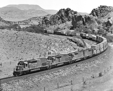 Westbound Southern Pacific Railroad intermodal train climbs toward Paisano Summit at Alpine, Texas, in August 1984. Photograph by J. Parker Lamb, © 2017, Center for Railroad Photography and Art. Lamb-02-086-11