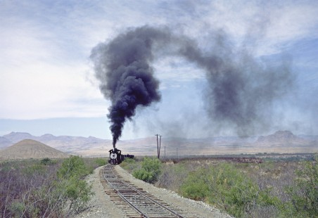 FC Mineral steam locomotive no. 4 throws a thick cloud of smoke over the barren landscape near Avalos, Mexico, on April 26, 1967. Photograph by Fred M. Springer, © 2016, Center for Railroad Photography and Art. Springer-Mexico1-13-31