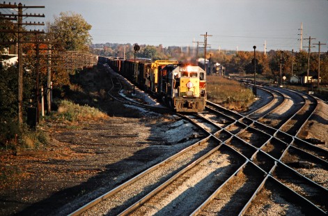 Westbound Erie Lackawanna Railway freight train crossing in front of a westbound Baltimore and Ohio Railroad freight train at RU Tower in Sterling, Ohio, on October 11, 1975. Photograph by John F. Bjorklund, © 2016, Center for Railroad Photography and Art. Bjorklund-55-13-15