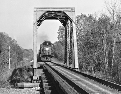 Westbound Southern Pacific Railroad feright train blows through short truss bridge near Harwood, Texas, in April 1985. Photograph by J. Parker Lamb, © 2016, Center for Railroad Photography and Art. Lamb-02-055-10