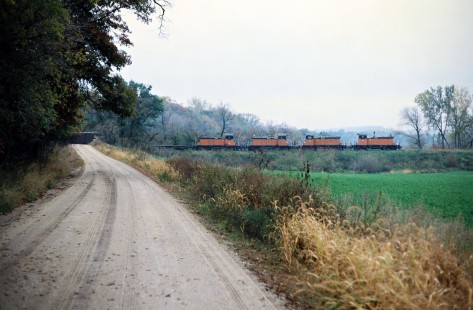 Westbound Milwaukee Road freight train in Isinours, Minnesota, on September 29, 1977. Photograph by John F. Bjorklund, © 2016, Center for Railroad Photography and Art. Bjorklund-65-18-09
