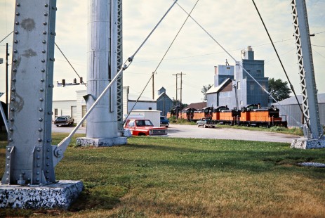 Eastbound Milwaukee Road freight train led by SW1 switchers at Harmony, Minnesota, on July 19, 1976. Photograph by John F. Bjorklund, © 2016, Center for Railroad Photography and Art. Bjorklund-64-29-02