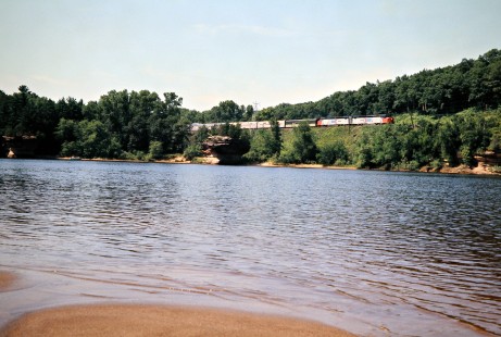 Eastbound Amtrak passenger train no. 8, the <i>Empire Builder</i>, at Wisconsin Dells, Wisconsin, on July 4, 1975. Photograph by John F. Bjorklund, © 2016, Center for Railroad Photography and Art. Bjorklund-64-25-16