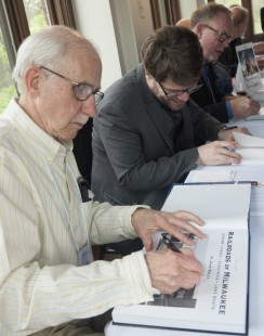 John Kelly, Alex Craghead, and Kevin Keefe sign books at the authors' table at Saturday's reception. Center for Railroad Photography and Art. Photograph by Henry A. Koshollek
